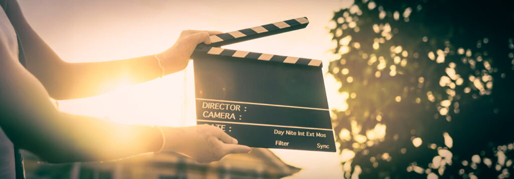 woman holding clapperboard