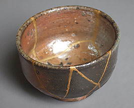 Kintugi technique of repairing pottery with gold